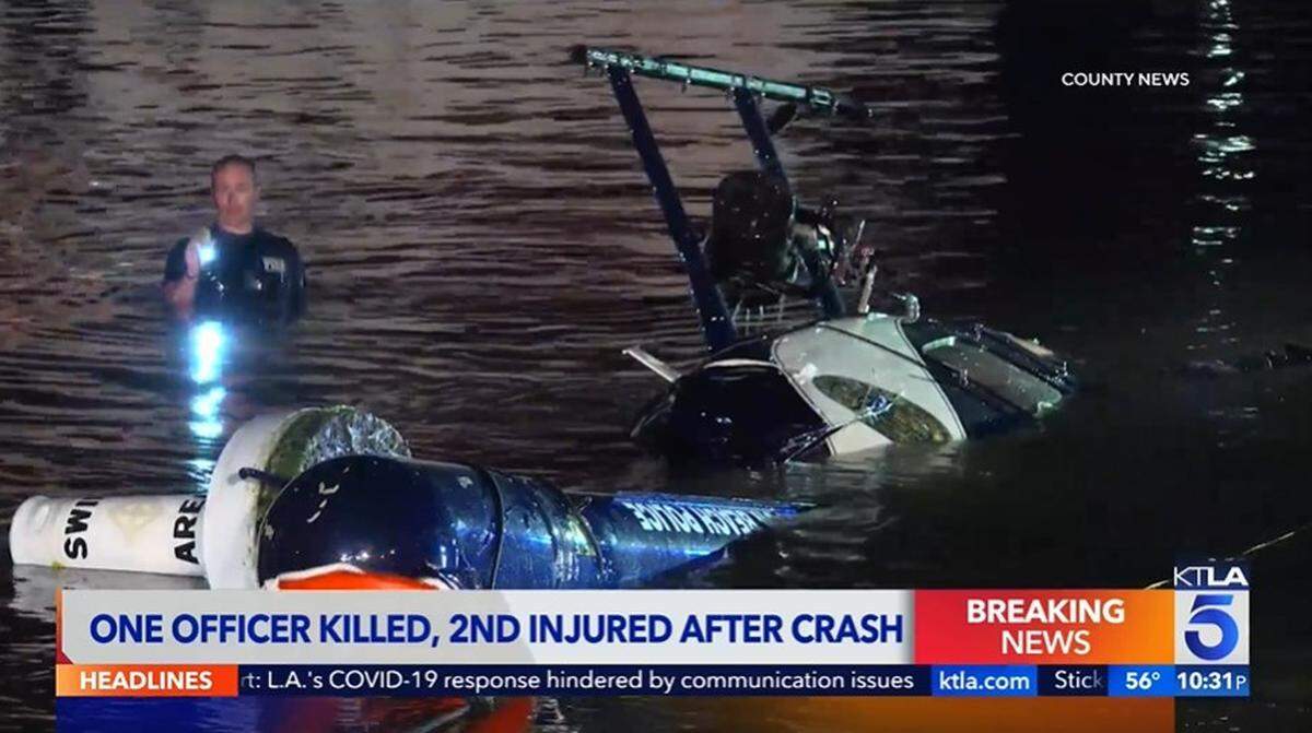 A Huntington Beach, California, police officer died and another was injured when their helicopter crashed into the ocean off Newport Beach, officials say.