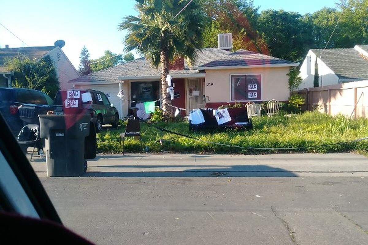 Samantha Urke said her roommate, Stevante Clark, put her furniture and other belongings on the front yard during a standoff with police, and barricaded the street with trash cans.