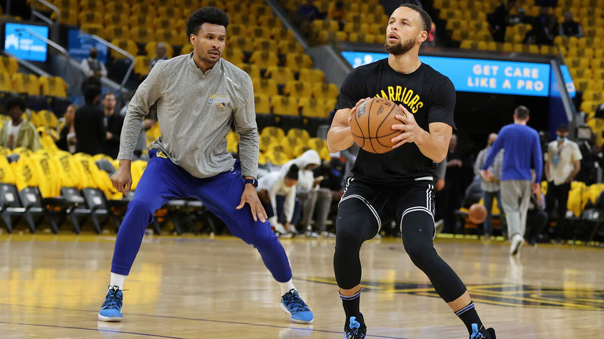 Golden State Warriors guard Stephen Curry warms up with coach Leandro Barbosa before Game 5 of the NBA basketball playoffs Western Conference finals against the Dallas Mavericks in San Francisco, Thursday, May 26, 2022. (AP Photo/John Hefti)