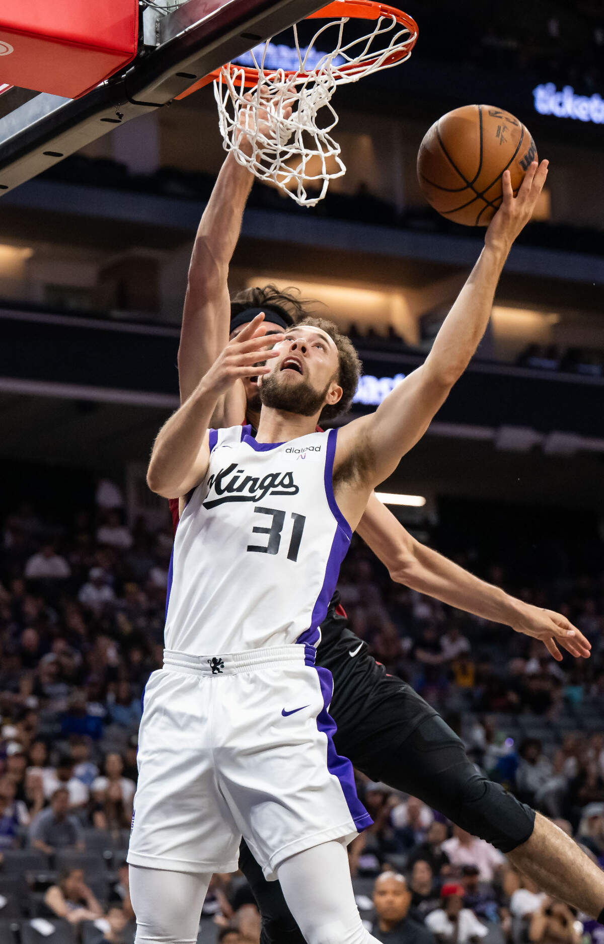 Sacramento Kings guard Jordan Ford (31) drives to score a layup past Miami Heat forward Jaime Jaquez Jr. (11) during the first half of their California Classic NBA summer league basketball game Wednesday, July 5, 2023, at Golden 1 Center.