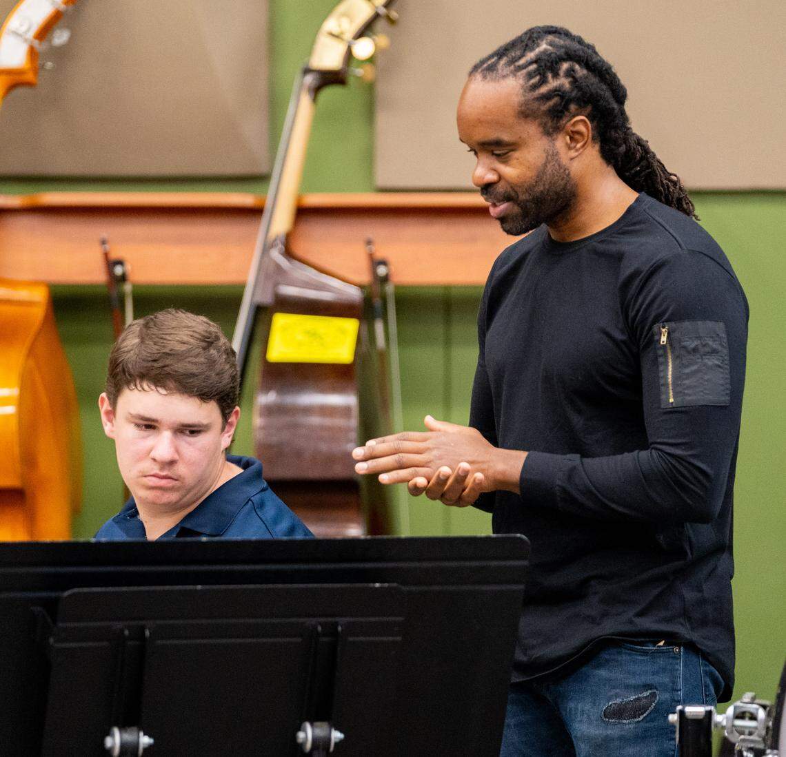 Jazz at Lincoln Center Orchestra drummer Obed Calvarie, right, gives advice to Rio Americano senior Zack Long, left, on Sunday, Sept. 11, 2022.