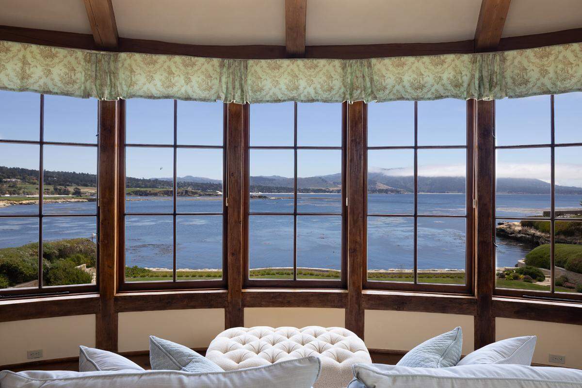 The 11,223-square-foot residence, built in 2003, flows from expansive living and entertaining areas to expertly landscaped grounds — all overlooking Stillwater Cove and Carmel Beach.