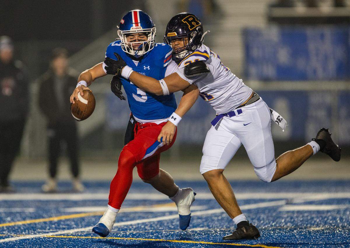 Folsom Bulldogs quarterback Ryder Lyons is sacked in the second quarter by Riordan Crusaders defensive end Zachary Kleppin (21) in the CIF Northern California Regional Division 1-AA football championship game in Folsom on Friday. Lyons exited the game with an injury in the third quarter.
