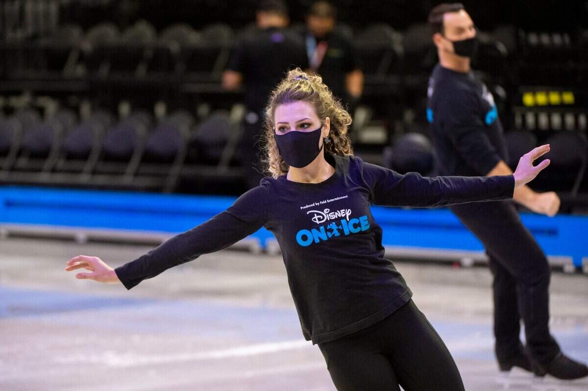 Ice skater Haylie Ferreira warms up with Terry Lawton for her performance in the Disney on Ice at Golden 1 Center in Sacramento on Thursday.