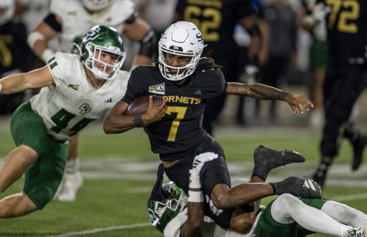 Sacramento State Hornets quarterback Cardell Williams (7) is tackled after a short gain in the second half against the Cal Poly Mustangs on Saturday in Sacramento.