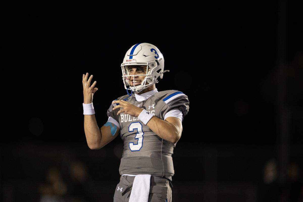 The Folsom Bulldogs’ Ryder Lyons (3) gestures towards the sidelines after throwing a touchdown In the first half against the Granite Bay Grizzlies on Friday, Oct. 31, 2025 in Folsom.