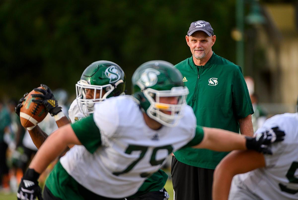 Assistant coach Kris Richardson leads players through drills at Sacramento State on Wednesday, Oct. 16, 2019. New head coach Brennan Marion is retaining Richardson as offensive line coach in 2025.