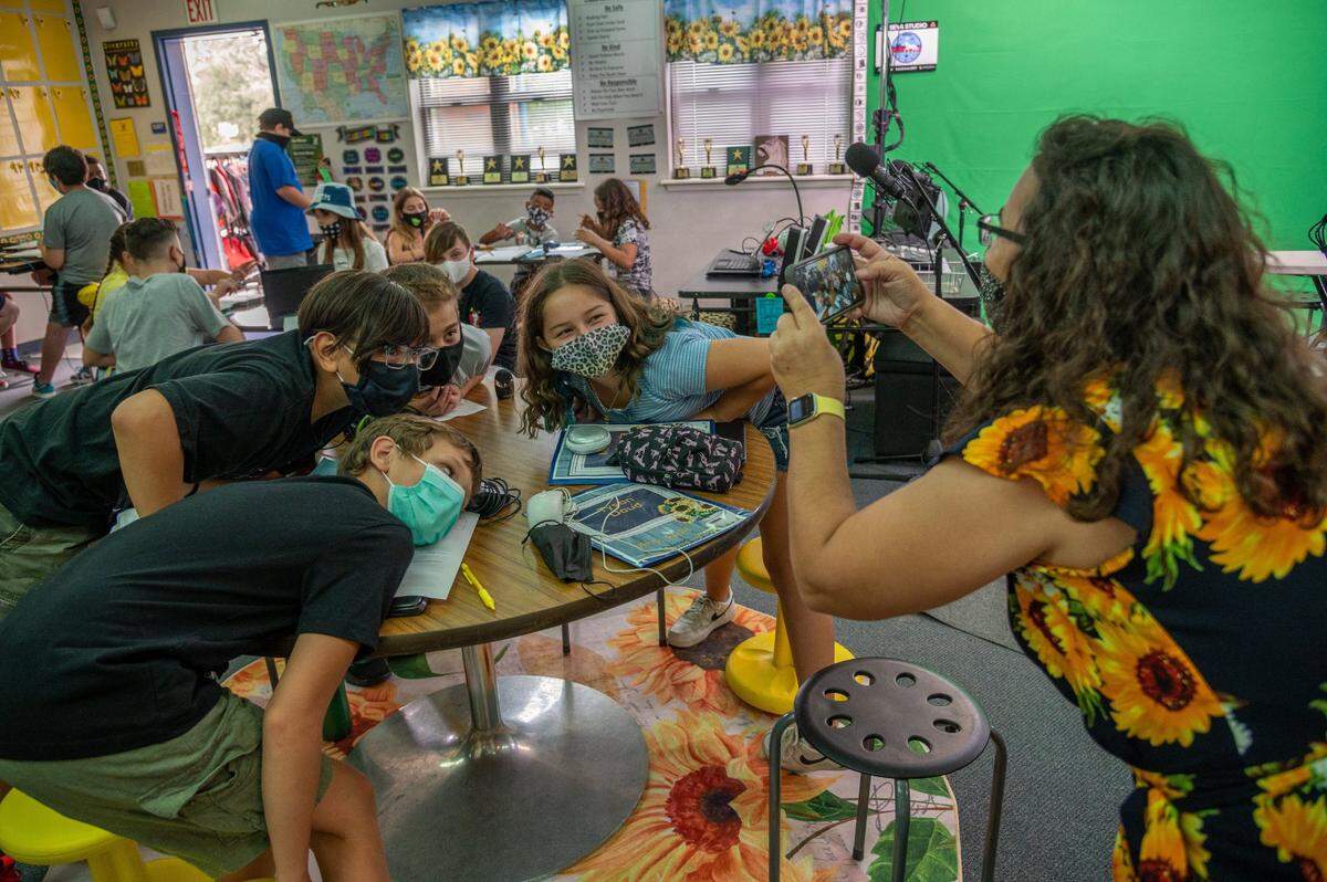 Sixth-grade teacher Tammy Null takes a picture of some of her students at Florence Markofer Elementary School in Elk Grove on Aug. 12.