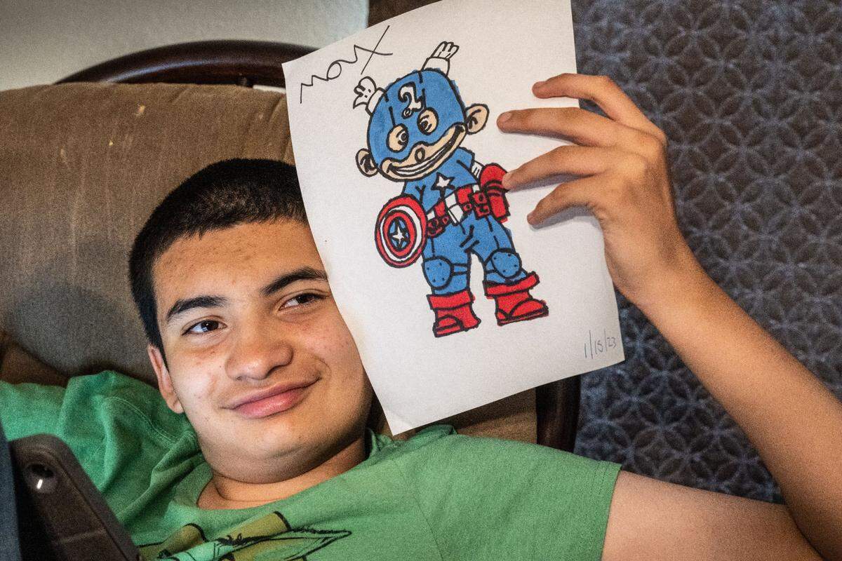 Max Moran Soto, 14, who was diagnosed at age 3 with autism and attention deficit hyperactivity disorder, holds a drawing he made on Thursday, Aug. 24, in Manteca.