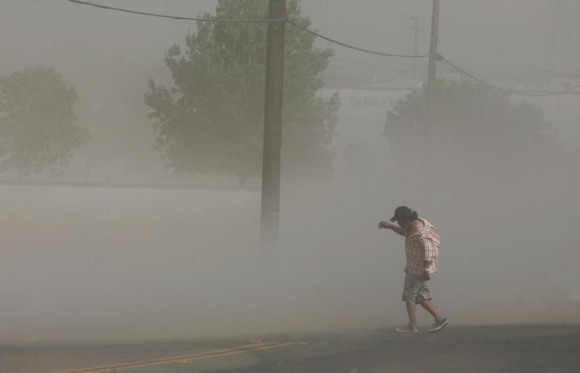 Dust storms like this one that blasted Fresno in June 2012 can carry millions of spores from the fungus that causes valley fever. In the first half of 2018, more than 280 cases of valley fever have been reported in San Luis Obispo County, which is caused by a type of fungus in kicked-up dust.