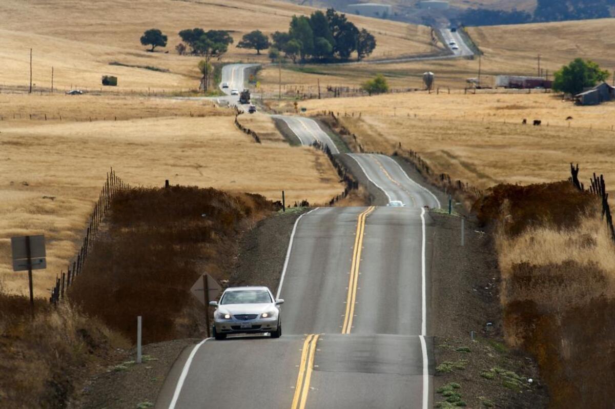 Drivers follow a narrow, winding section of White Rock Road in Sacramento County south of Highway 50. If the Capital SouthEast Connector project is fully realized, commuters will have a multi-lane route between Elk Grove and El Dorado Hills.