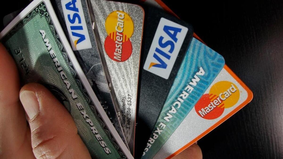 Credit analysts say consumer credit delinquencies are rising in 2018, a year when interest rates also are expected to climb. “Simply put, there's only so much credit card debt Americans can absorb without it causing real problems,” said one analyst. In this March 5, 2012, file photo, consumer credit cards are posed in North Andover, Mass.