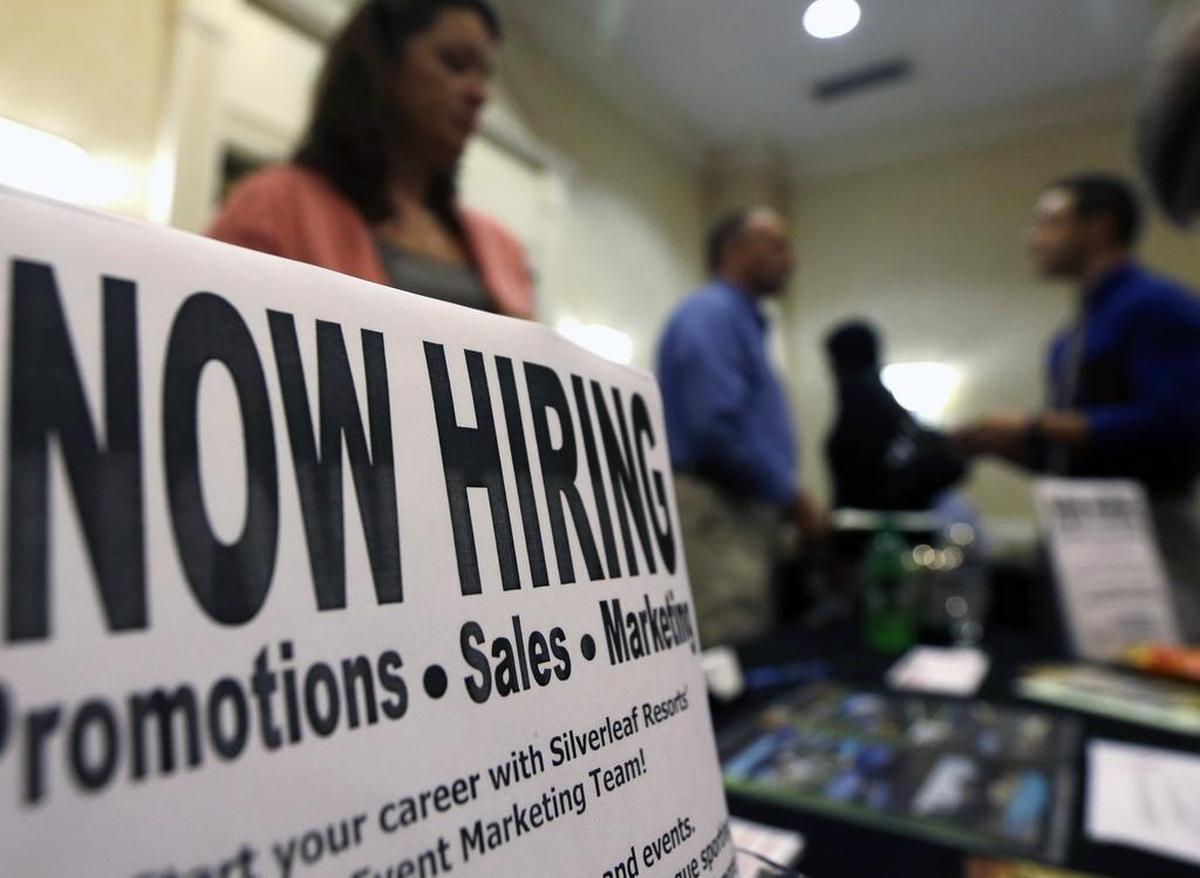 A sign attracts job-seekers during a job fair. Many Californians, including SLO County residents, remain out of work.