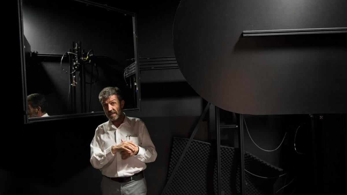 Konstantinos Papamichael, co-director of the California Lighting Technology Center at UC Davis, shows a light-measuring device called a spectral goniophotometer at the center in June.