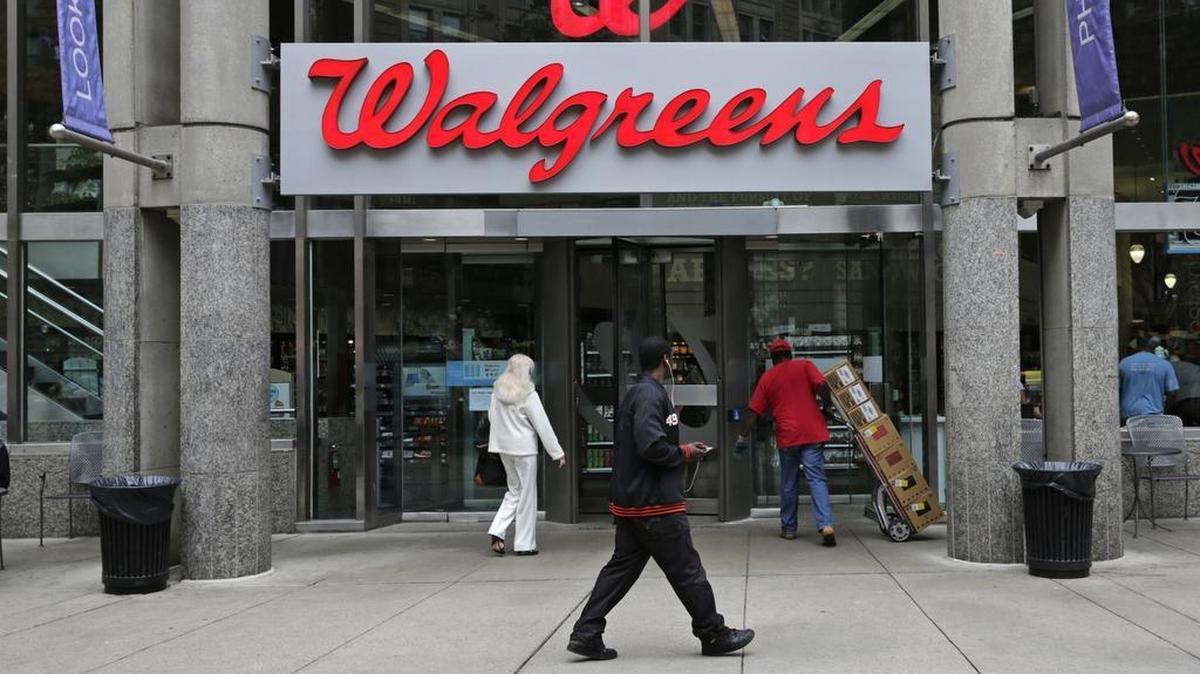 FILE - This June 4, 2014, file photo, shows a Walgreens retail store in Boston.