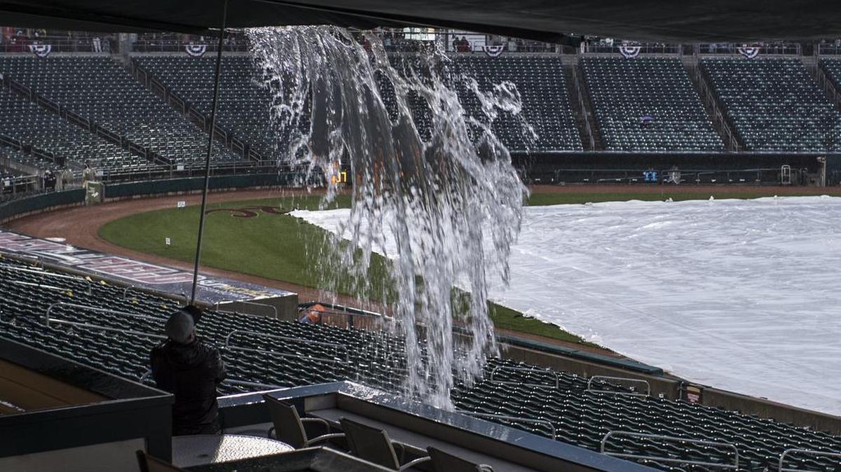 An employee of Raley Field releases water from sun shades during the RiverCats opening day before it was rained out at Raley Field on Thursday, April 6, 2017, in Sacramento.