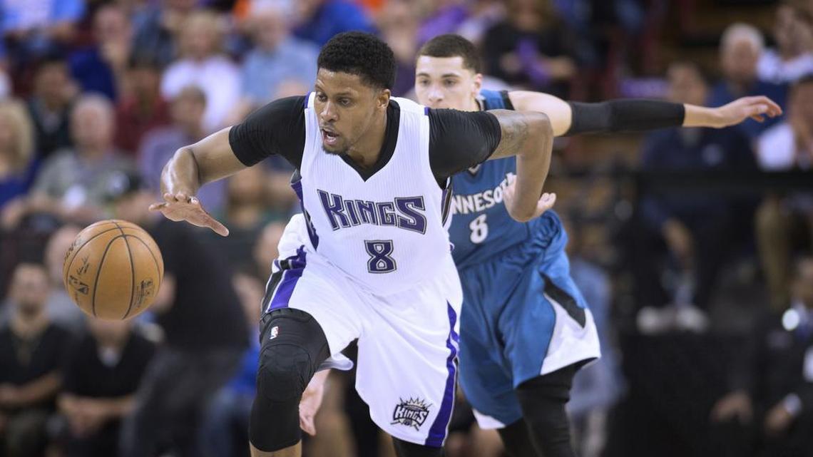 Kings forward Rudy Gay dribbles on the break, pursued by Minnesota guard Zach LaVine in third quarter action at Sleep Train Arena on Thursday, April 7, 2016.