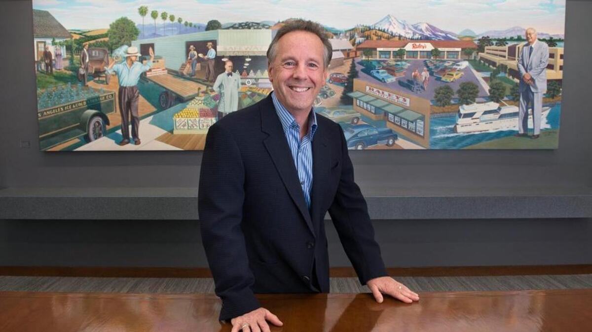 CEO Michael Teel stands before a mural depicting the history of Raley’s inside the board room at the supermarket headquarters on Monday, Dec. 10, 2015, in West Sacramento. Raley’s marked 80 years in business by elevating Teel to majority ownership, closed a handful of underperforming stores and announced the planned opening of three new stores.announcement in six years.