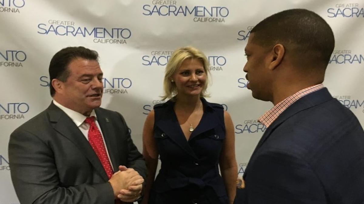 Barry Broome, chief executive of the Greater Sacramento Area Economic Council, talks with Parrable CEO Carla Holtze and Sacramento Mayor Kevin Johnson on Wednesday at Sacramento State.