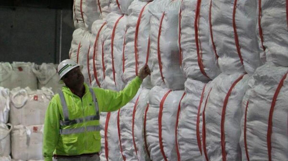 Jeff Stiles, superintendent of SSA Marine, inspects bags of rice to be loaded aboard a ship at the Port of Sacramento in West Sacramento, Calif., on Friday, Nov. 23, 2012. The state’s export of agricultural products and raw materials edged up 1.8 percent in September 2016.