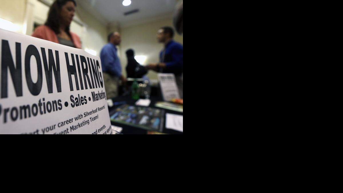 
 A sign attracts job-seekers during a job fair at a Marriott Hotel last month in Colonie, N.Y.
