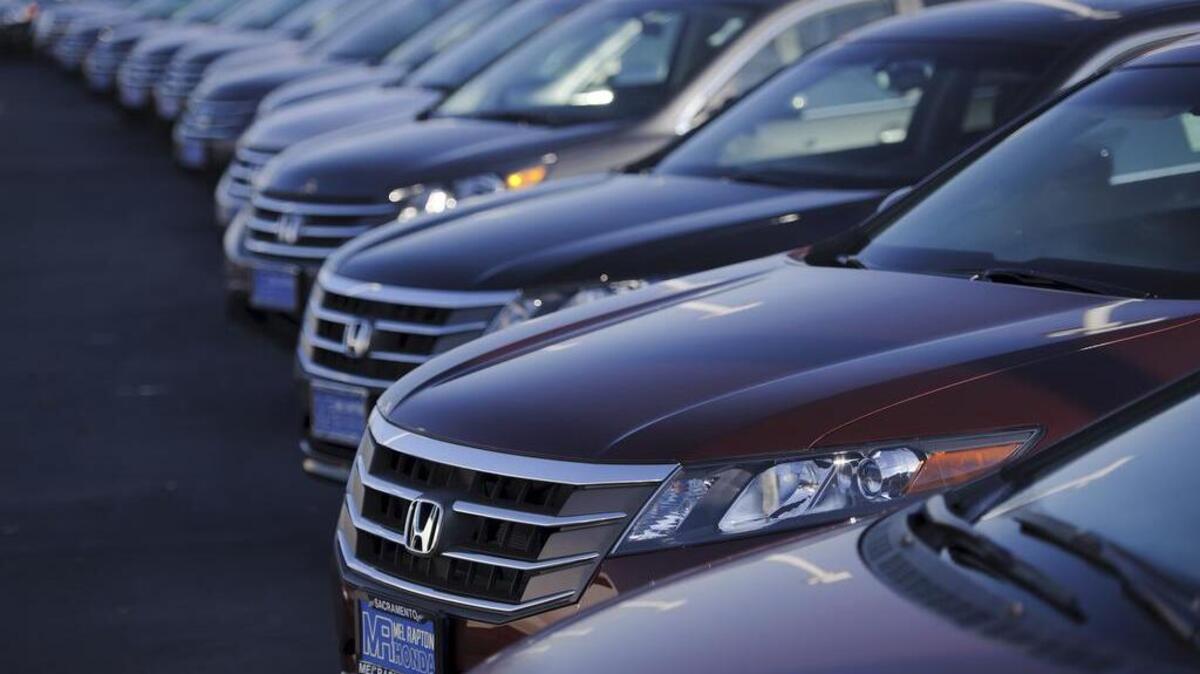 FILE -- New Honda automobiles are displayed at Mel Rapton Honda on December 10, 2012 in Sacramento, Calif. The Sacramento-based California New Car Dealers Association settled litigation with automotive pricing website TrueCar on Thursday, Dec. 14, 2017.