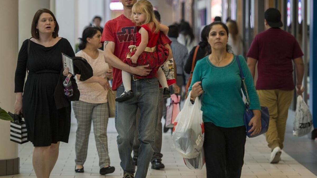 Justin Bradford and wife Ann Bradford, left, with their daughter Ashley completed their picture taking with Santa Claus to avoid the holiday lines that become packed during the weeks before Christmas on Wednesday, Nov. 11, 2015, in Sacramento, Calif.