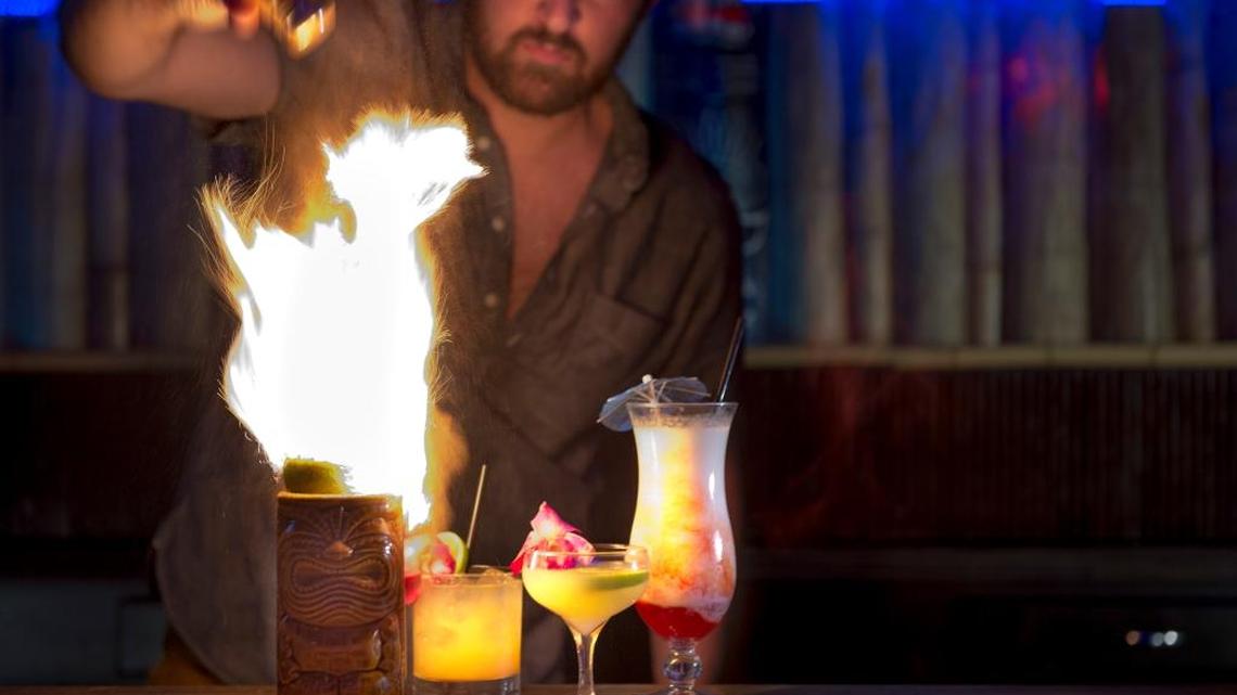 Elliott Ames, cocktail consultant for Rum Rok, prepares the bar’s specialty drinks on Saturday, Dec. 26, 2015. The drinks, from left: painkiller at $8, Trader Vic’s mai tai, $8, classic daiquiri, $9, and lavaflow, $6.