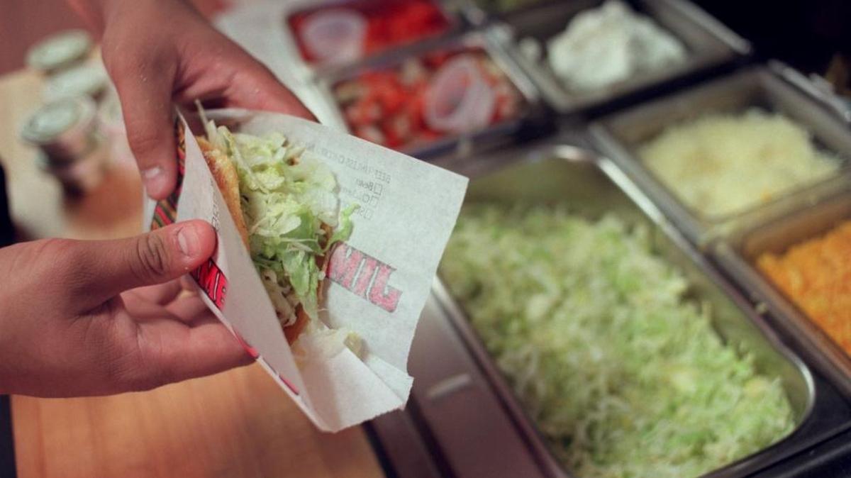 A Jimboy’s Tacos employee prepares a customer’s order. The Folsom-based chain’s midtown Sacramento store will close after 52 years on Thursday.