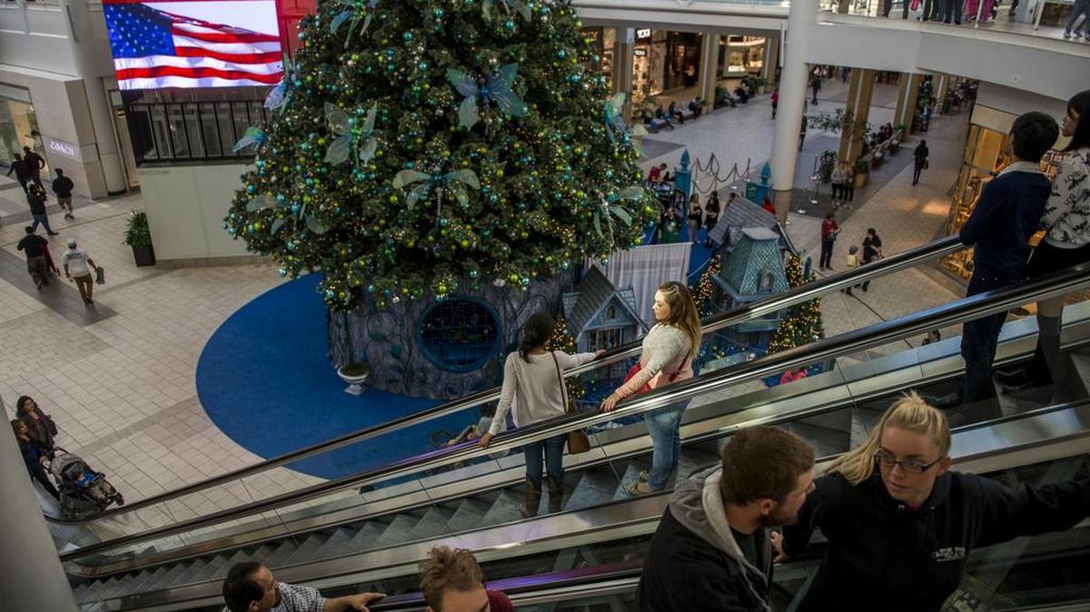 Shoppers flock to Arden Fair on Nov. 11, 2015, in Sacramento. An improving economy may prompt consumers to spend a bit more this holiday season than last year, retail experts say.