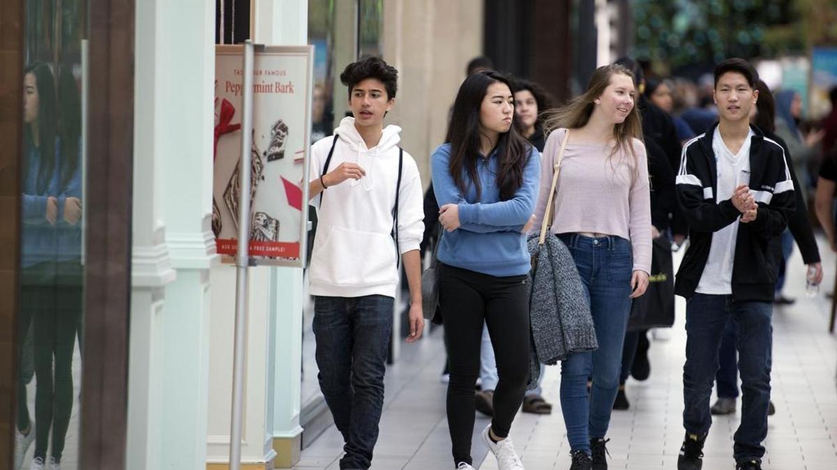 From left, Sacramento residents Isaac Villadolid, 12; Amy Li, 15; and Jessica Andryushchenko, 15; and Jay Kim, 17, of Los Angeles walk through Arden Fair mall Tuesday in Sacramento. A new policy at the mall prevents underage kids from entering the mall without adult supervision on certain busy days.