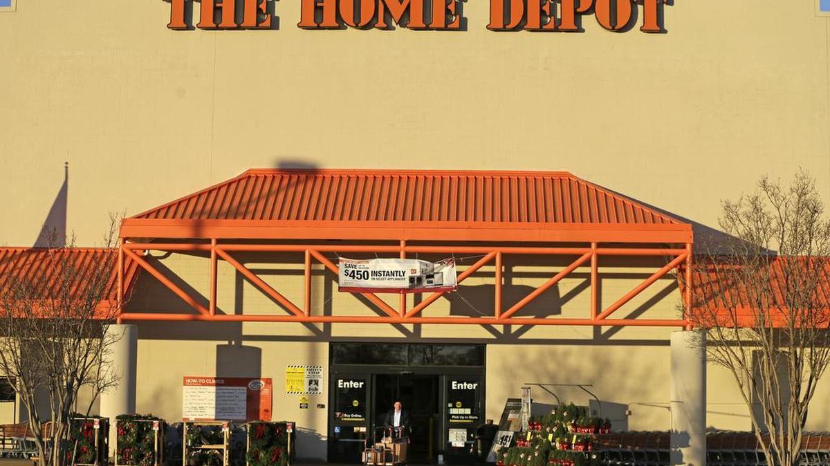 FILE - In this Nov. 18, 2014 file photo, a customer leaves at a Home Depot store in Matthews, N.C. The nation's largest home improvement chain, based in Atlanta, said Wednesday, Feb. 3, 2016, it's hiring more than 80,000 workers nationwide for its busy spring season, the same level as in recent years.