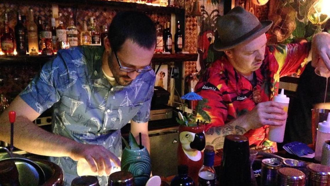Jungle Bird bartenders mix a batch of drinks for the bar’s grand opening in October 2016. The couple behind The Jungle Bird and Tank House are planning to open a 50s-inspired cocktail lounge called the Ten Ten Room.