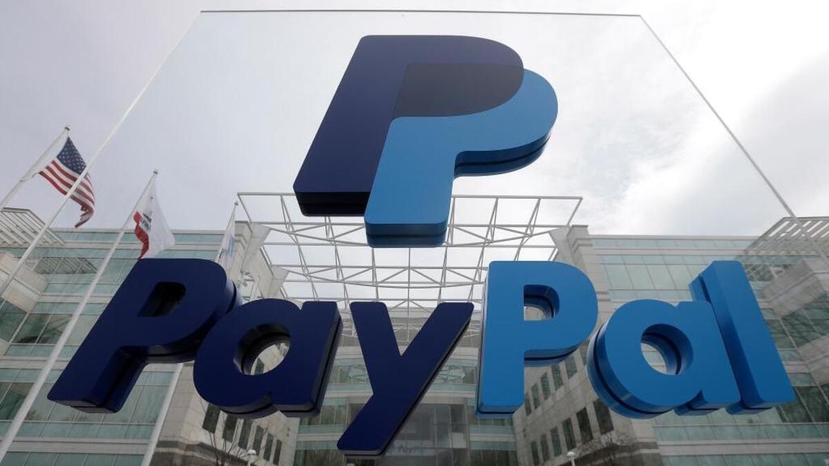 This March 10, 2015, file photo, shows signage outside PayPal's headquarters in San Jose.