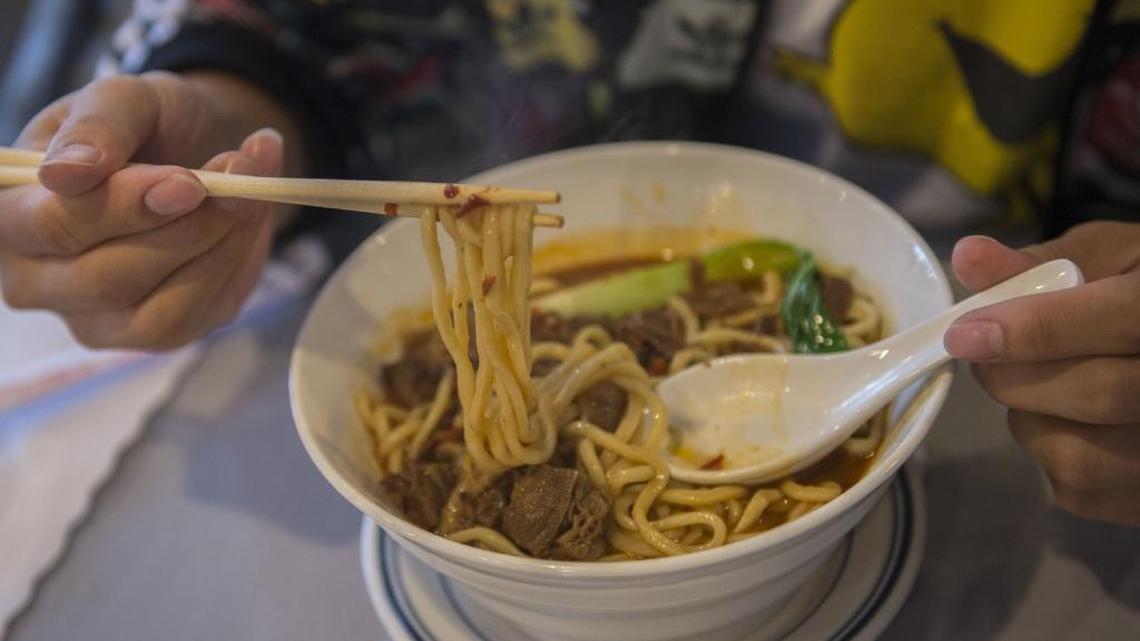 UC Davis sophomore Kevin Wang, 21, has a lunch bowl of beef noodle soup he ordered from the Chinese menu at Hunan Bar and Restaurant on Thursday, Sept. 29, 2016, in Davis, Calif. Originally from Xiamen in the Fujian province, he is studying managerial economics.