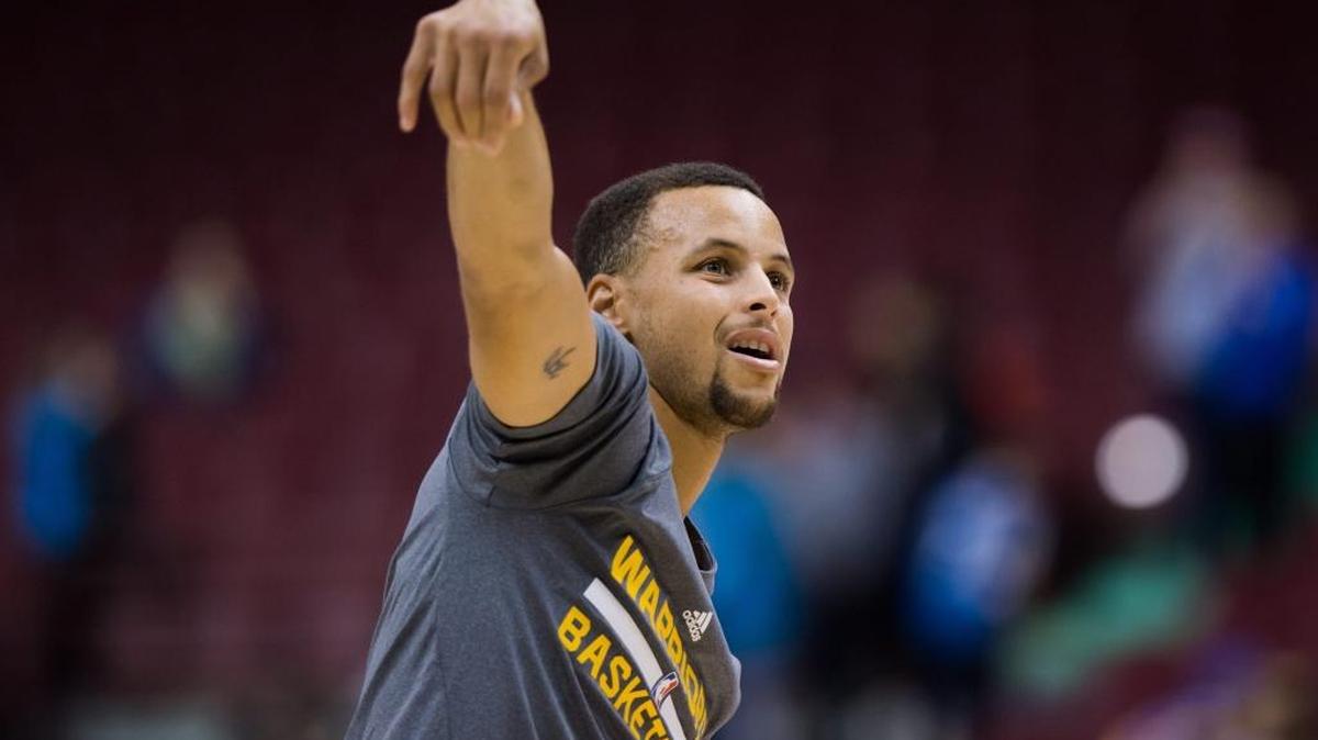 Golden State Warriors' Stephen Curry watches a shot while warming up before a preseason NBA basketball game against the Toronto Raptors in Vancouver, British Columbia, Saturday Oct. 1, 2016.