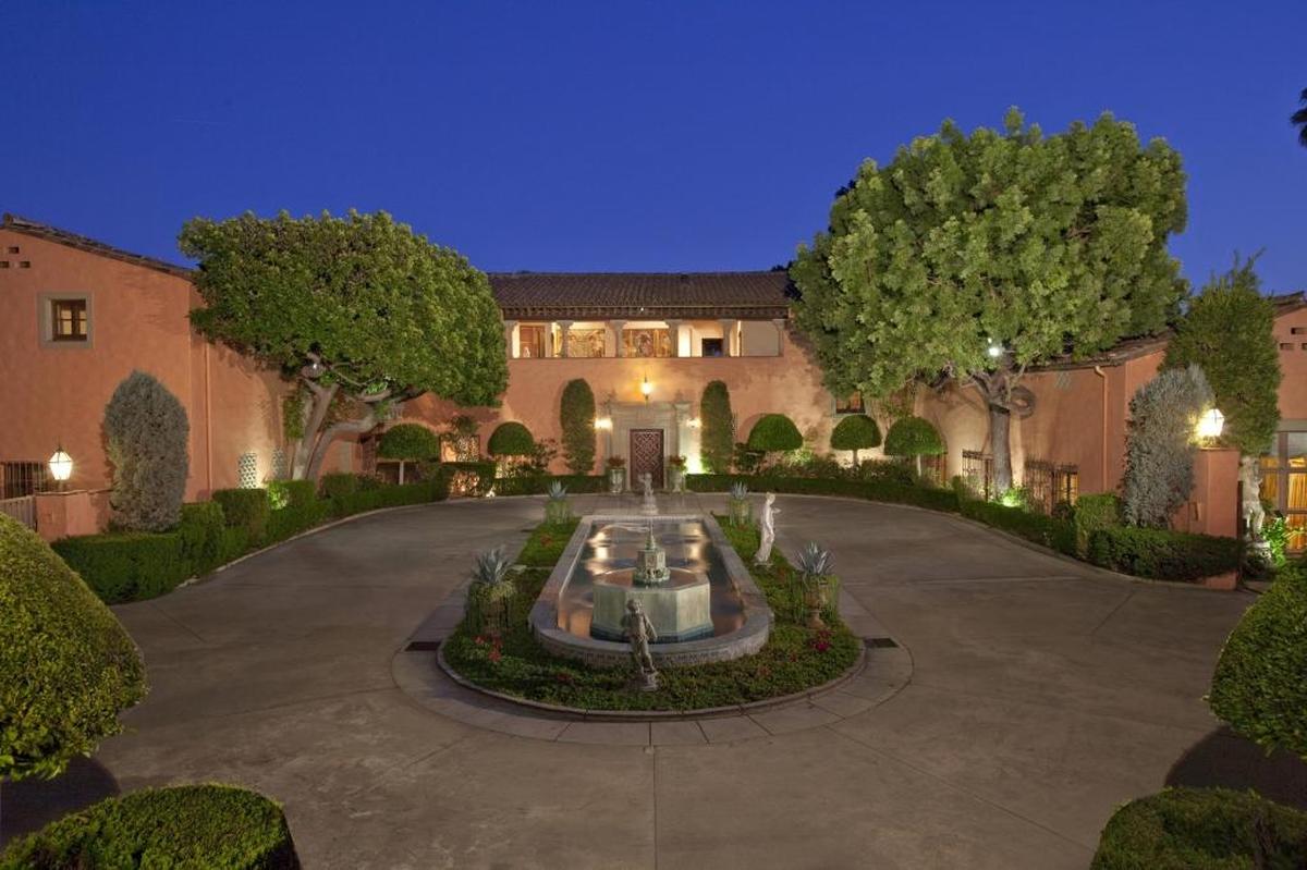 The Beverly House, once home to publishing magnate William Randolph Hearst and actress Marion Davies, has come back on the market at $195 million, $30 million more than what it last publicly listed for in 2007. Designed by Gordon Kaufmann, the H-shaped mansion offers more than 50,000 square feet of interior space with 30 bedrooms and 40 bathrooms. A lighted tennis court, a swimming pool, two ponds, loggias, fountains and formal landscaping fill the grounds.