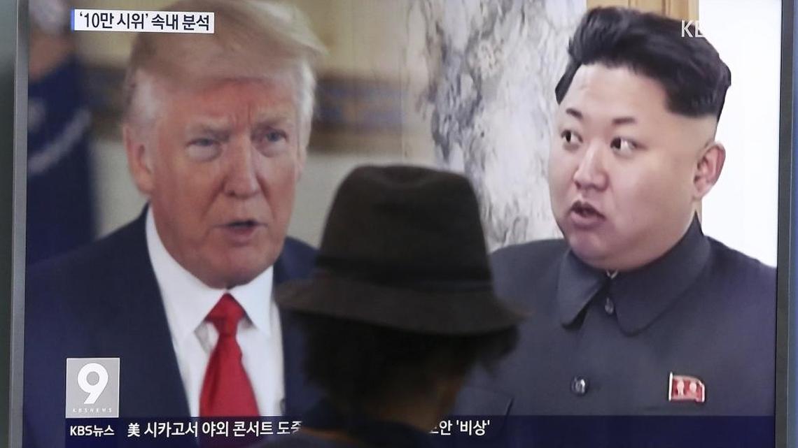 A man watches a television screen showing U.S. President Donald Trump, left, and North Korean leader Kim Jong Un during a news program at the Seoul Train Station in Seoul, South Korea, Thursday. Nuclear fears are driving up sales for two California bomb shelter manufacturers.