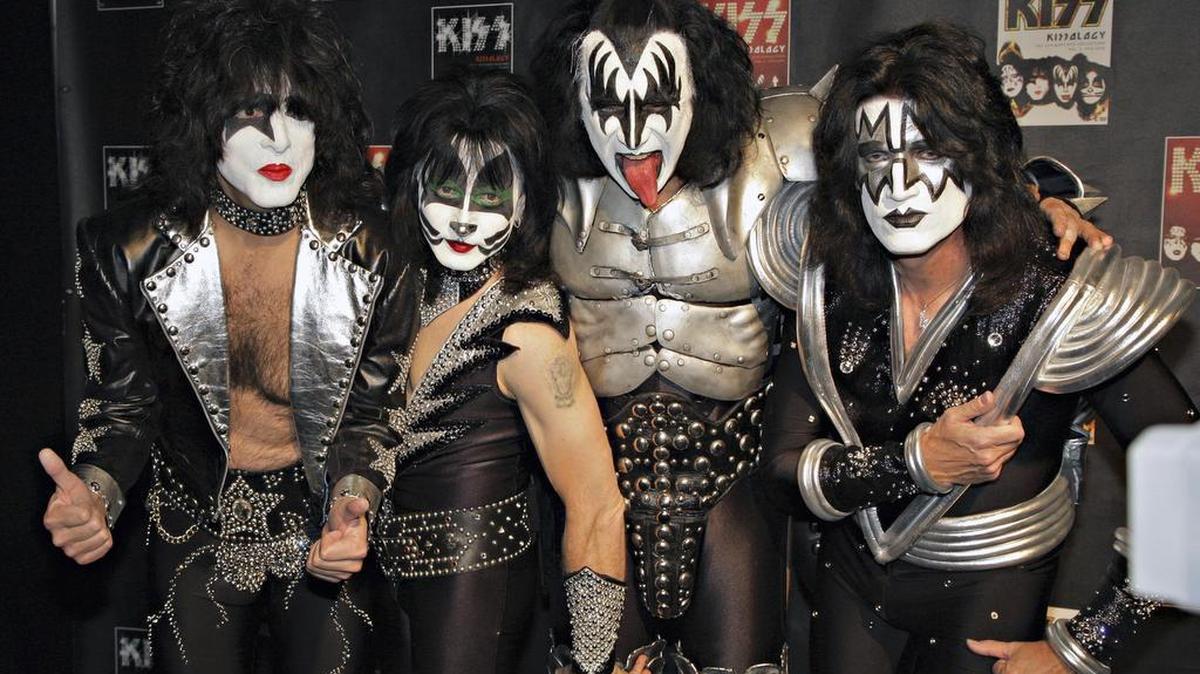 FILE - In this May 8, 2008 file photo, members of Kiss, from left, Paul Stanley, Eric Singer, Gene Simmons and Tommy Thayer, pose during a news conference to promote the start of their KISS Alive/35 European Tour in Oberhausen, Germany. (AP Photo/Volker Wiciok)
