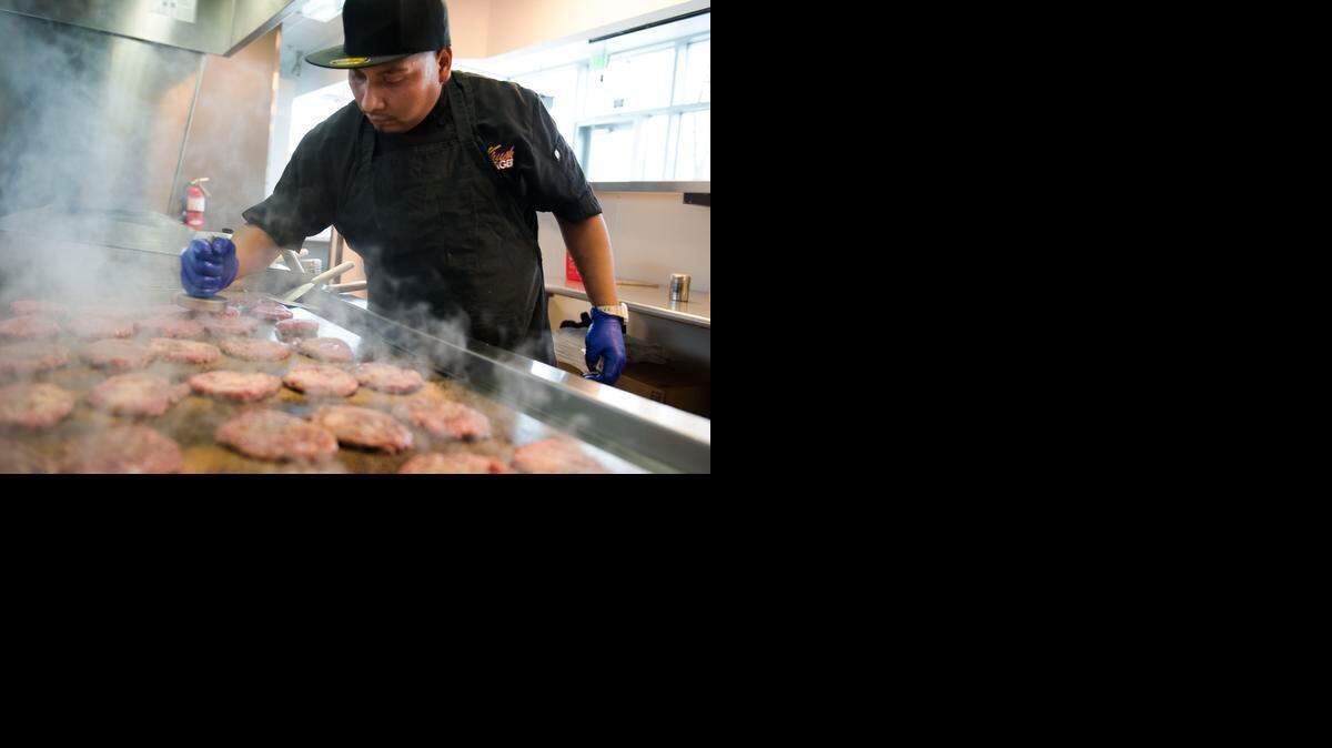 
Brigido Morales cooks burgers during lunch hour at a Sacramento Krush Burger. The fast-casual restaurant, like others such as Smashburger, In-N-Out Burger and Five Guys Burgers and Fries, aims to serve more healthful food with fresher ingredients, a growing trend in the industry.
