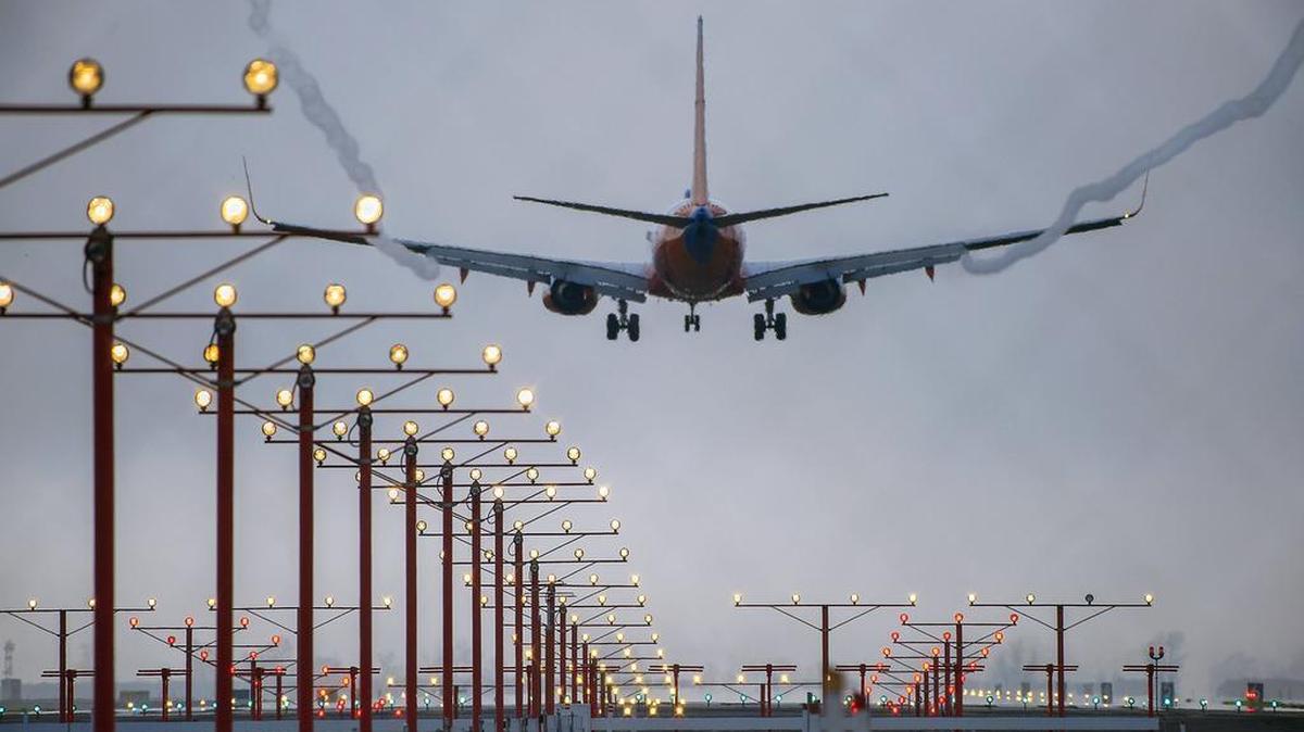 An air liner lands at the Sacramento International Airport in Sacramento on Wednesday, January 20, 2016.