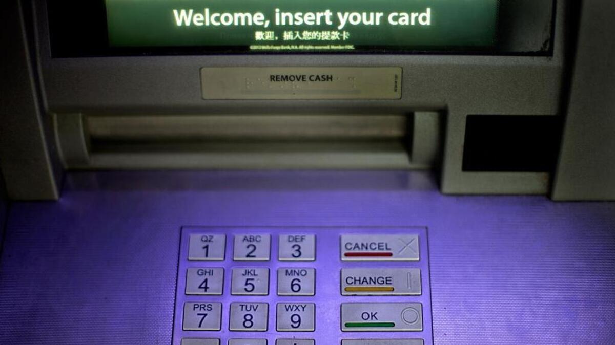 FILE - In this Tuesday, July 16, 2013, file photo, an ATM is displayed in Atlanta.