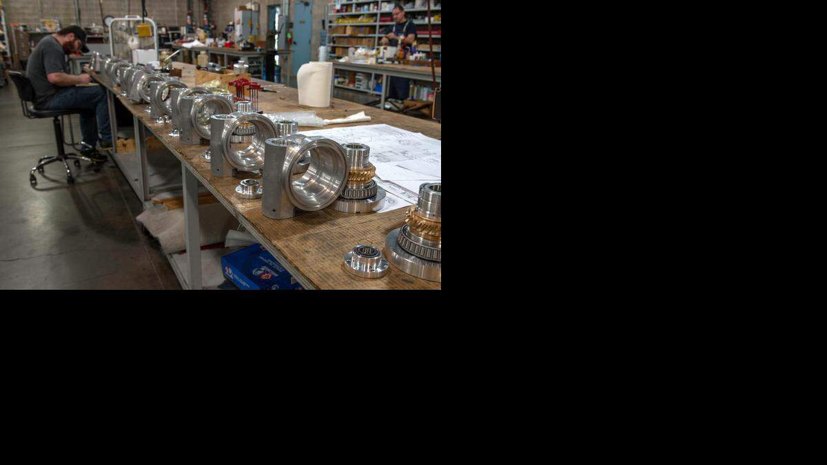 
Brandon Brown, left, works the assembly line at Tri  recently in Rancho Cordova. Tri Tool Inc., a manufacturer of precision portable machine tools and a provider of on-site construction services, is part of a post-recession manufacturing rebound locally and in California.
