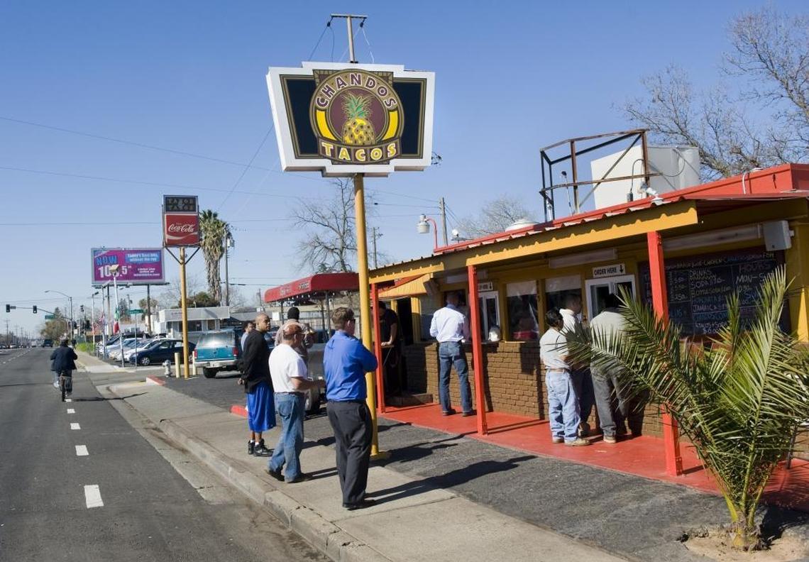 The original Chando’s Tacos draws a crowd on Arden Way during lunchtime.