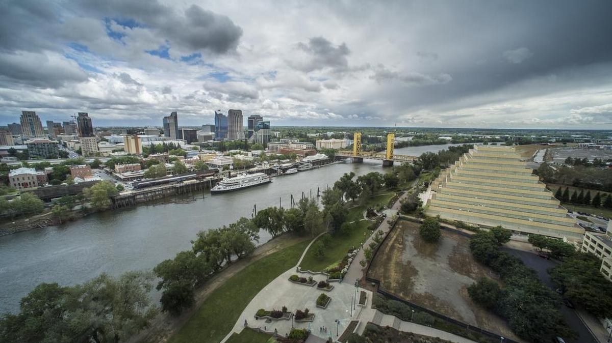 Clouds roll over the Sacramento skyline as seen from inside the CalSTRS building in West Sacramento last year.