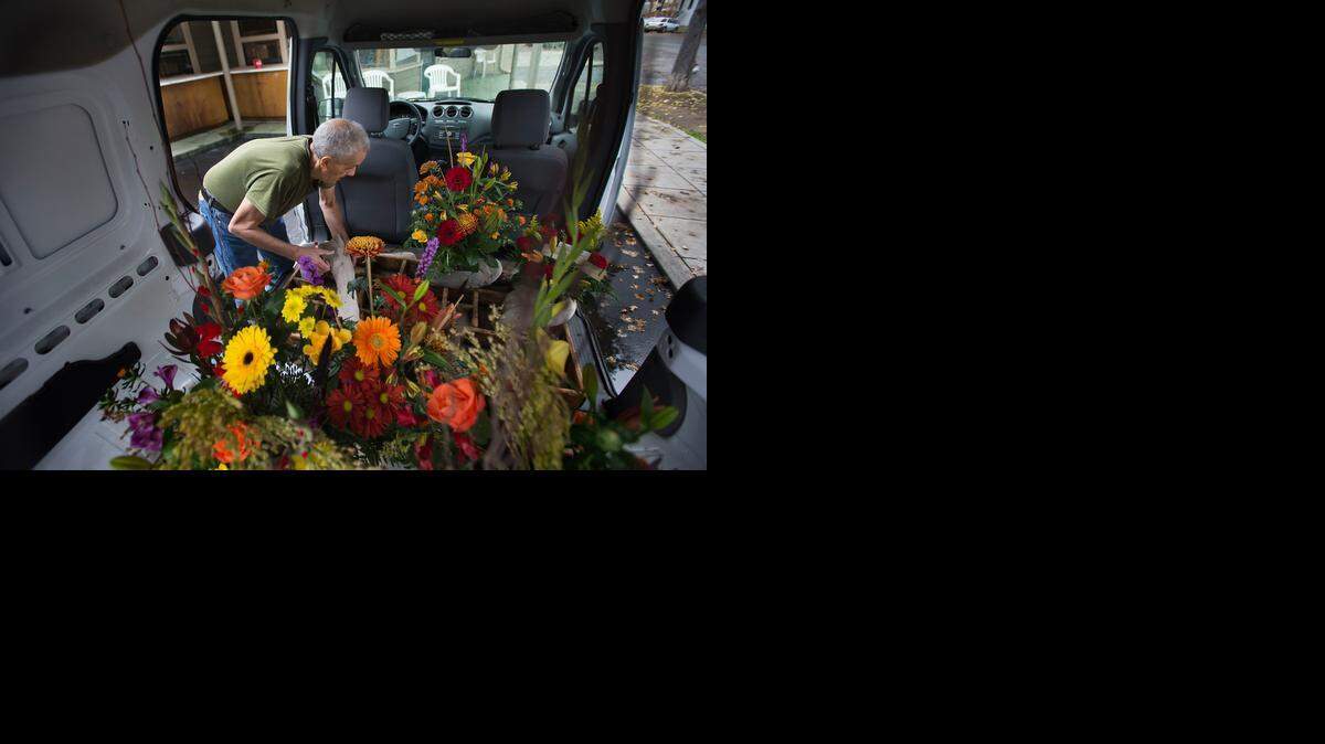 Michael Smith loads flowers into a truck for delivery at Relles Florist in midtown Sacramento on Nov. 20.