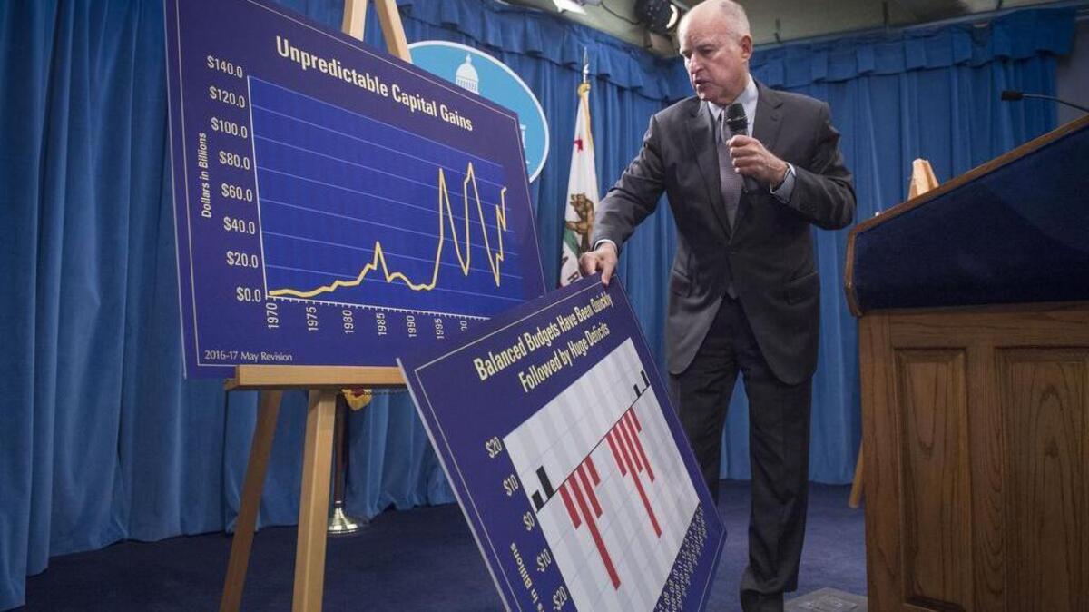 Gov. Jerry Brown discusses his revised budget and economic forecasts at the Capitol last Friday.