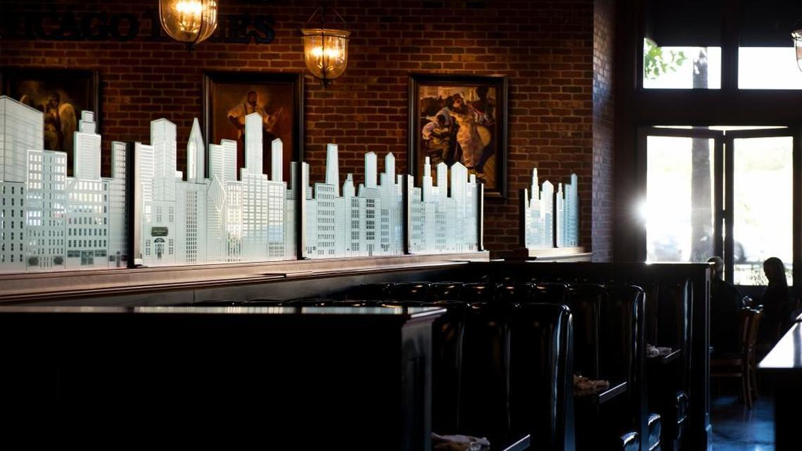 
A glass skyline of Chicago separates the dining area from the bar of the Chicago Fire pizza restaurant at the Palladio at Broadstone in Folsom.
