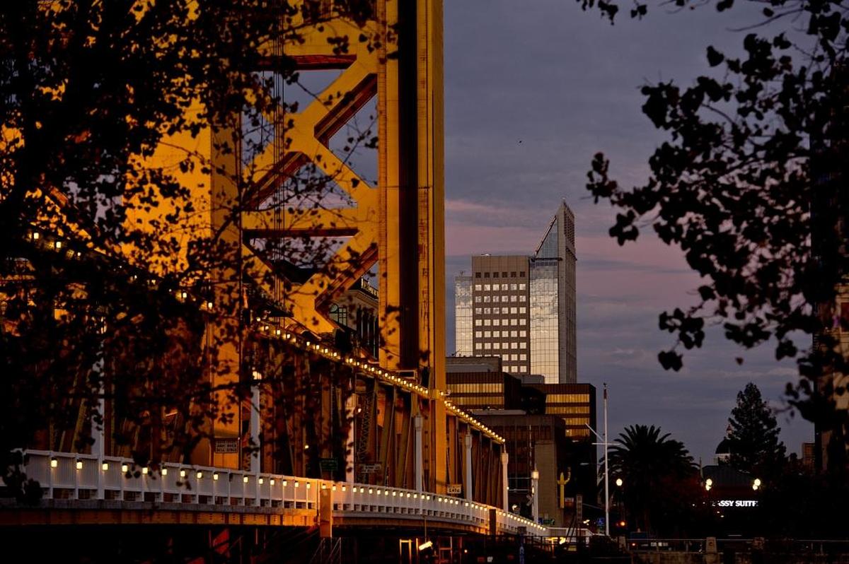 A view of the Tower Bridge from West Sacramento into downtown Sacramento at dusk with the US Bank Tower rising out of the center of the frame on November 12, 2013.