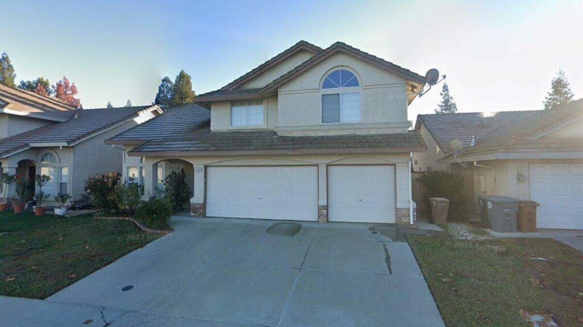 House on 8700 block of White Peacock Way